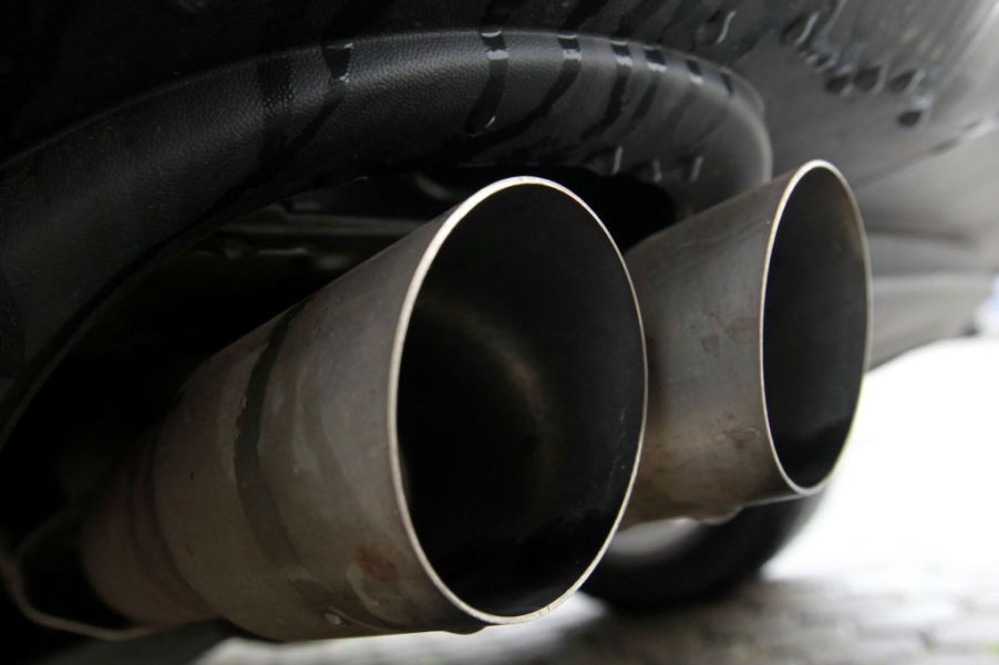 A close-up of the dual exhaust pipes on a performance car.