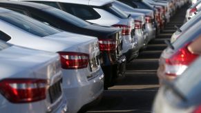 An assortment of new cars parked in a dealership lot.