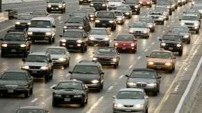 Cars driving down a crowded highway