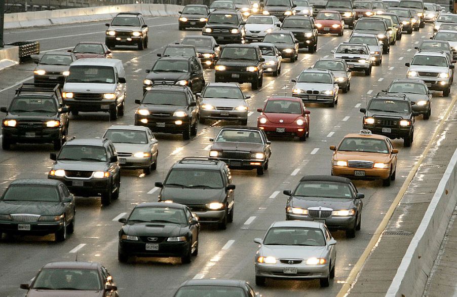 Cars driving down a crowded highway