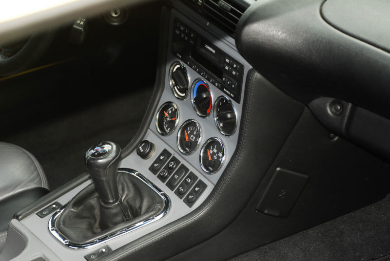 A close-up of the retro-inspired center console in a 2000 BMW Z3 M Roadster.