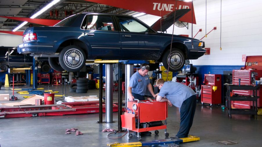 Motor car on hydraulic lift repair workshop Springfield Missouri USA