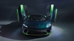 green McLAren GT Verdant with scissors doors open