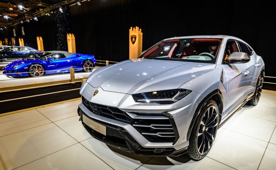 A new Lamborghini Urus on display at an auto show