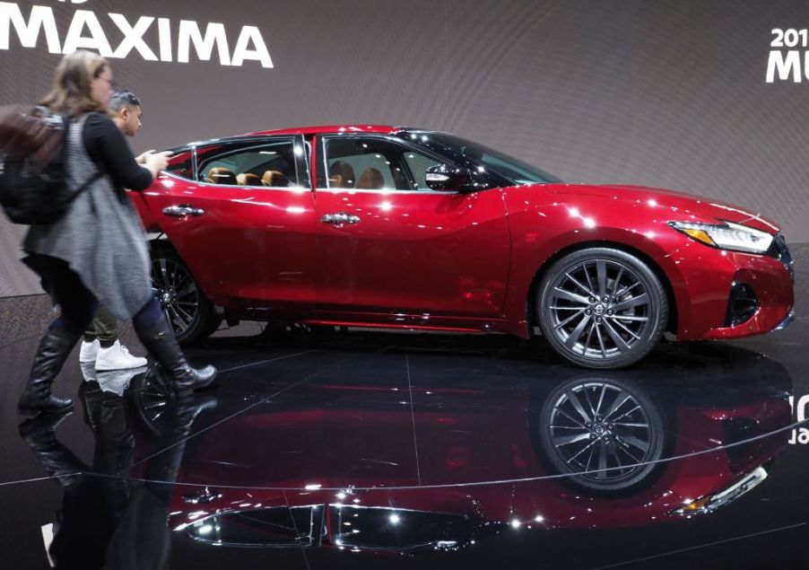 Attendees rush up to get a look at the 2019 Nissan Maxima at AutoMobility LA, the trade show ahead of the LA Auto Show