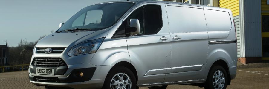 Silver Ford transit work van 