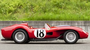 a 1957 Ferrari 250 Testa Rossa with a scenic background