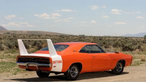 A Dodge Charger Daytona parked on a dusty road