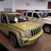 A 2010 Jeep Commander inside of a car dealership