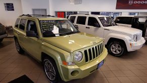 A 2010 Jeep Commander inside of a car dealership