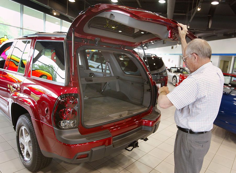 A man inspected a Chevy Trailblazer