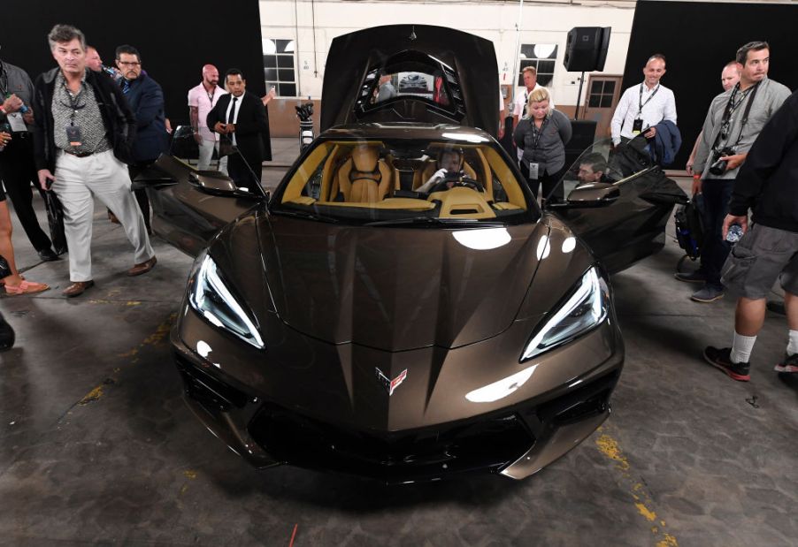 People gather around to look at the new Chevy C8 Corvette