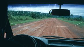 The view inside a car with a cracked windshield