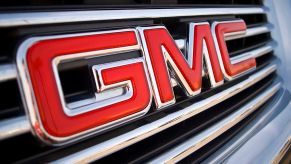 A GMC logo seen on the front of an SUV