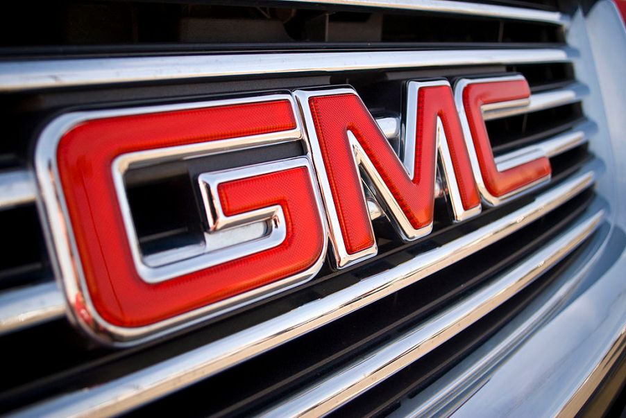 A GMC logo seen on the front of an SUV