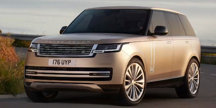 A gold Land Rover Range Rover full-size luxury SUV.