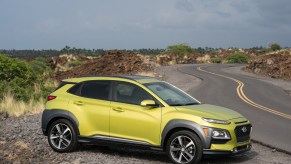 Hyundai Kona driving down country road