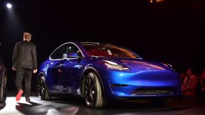 Tesla CEO Elon Musk walks past the new Tesla Model Y at its unveiling in Hawthorne, California