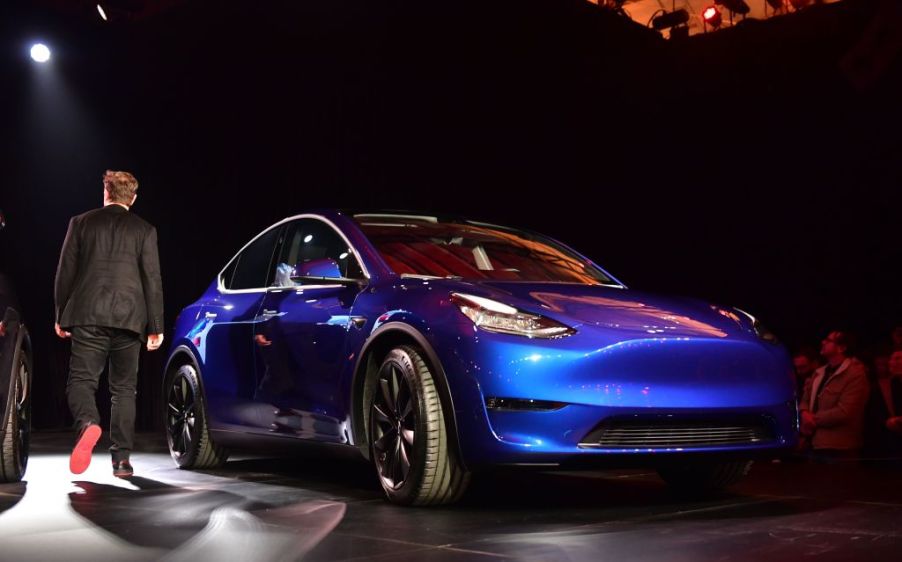 Tesla CEO Elon Musk walks past the new Tesla Model Y at its unveiling in Hawthorne, California