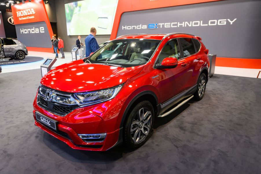 A red Honda CR-V on displat at an auto show