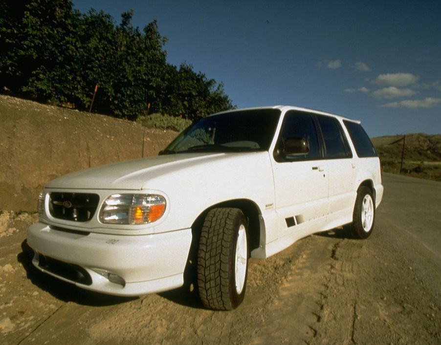 A white Saleen XP8 Ford Explorer parked on a dirt road