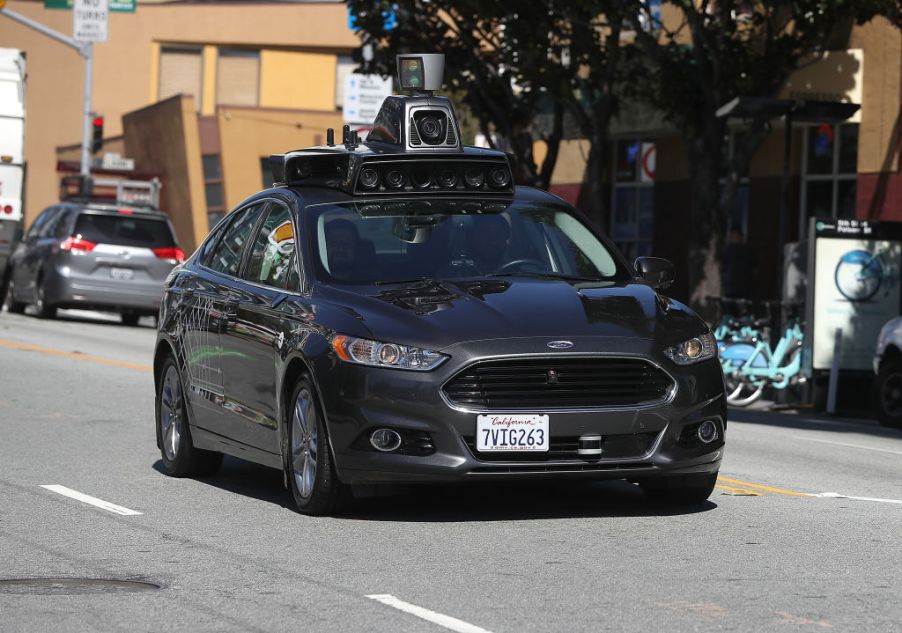 A self-driving car riding down the street