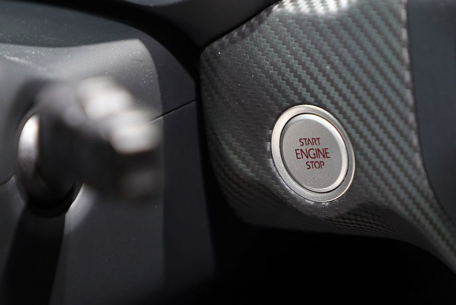 The engine ignition start/stop button of a Volkswagen XL1 plug-in diesel-electric hybrid automobile