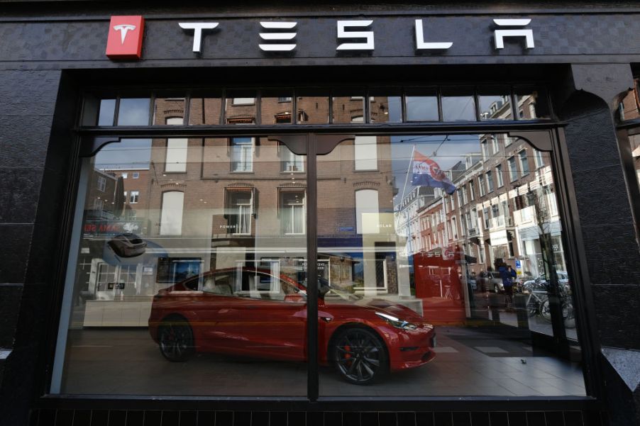 A logo of Tesla is seen outside its showroom