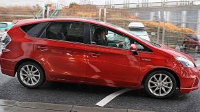 A Toyota Prius V sitting in a parking lot