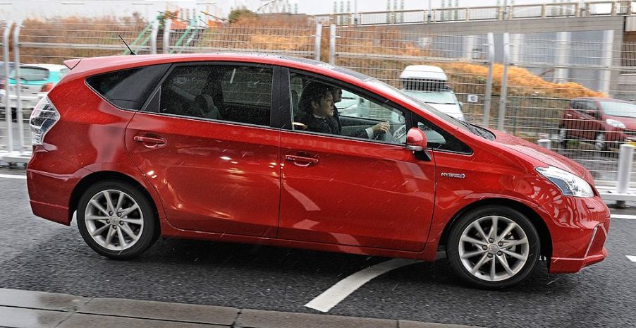 A Toyota Prius V sitting in a parking lot