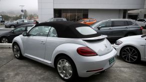 A brand new convertible Volkswagen Beetle is displayed on the sales lot at Serramonte Volkswagen