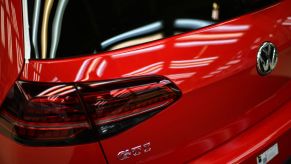 The back of a Volkswagen GTI Golf car is displayed at an assembly line at the Volkswagen factory