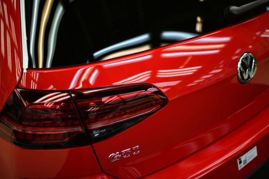 The back of a Volkswagen GTI Golf car is displayed at an assembly line at the Volkswagen factory