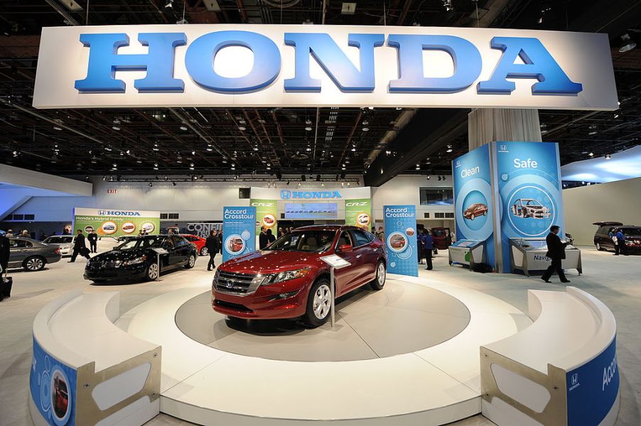 A red 2010 Honda Accord on display at an auto show