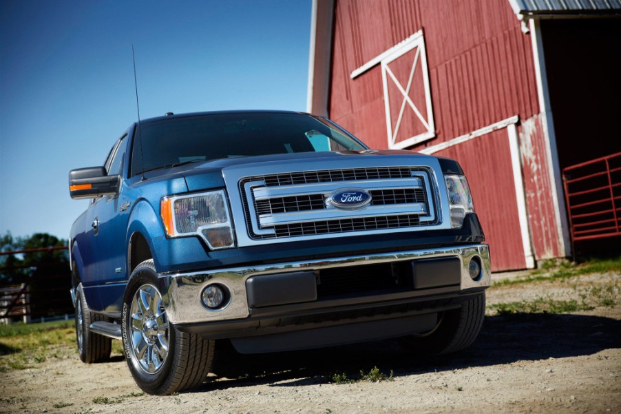 The 2014 Ford F-150 parked near a barn