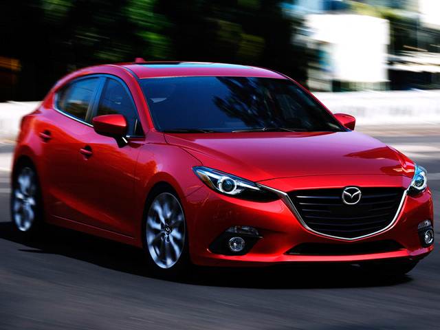 Bright red Mazda in drive mode.