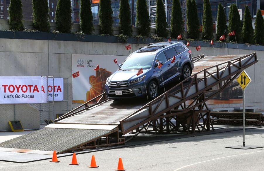 A 2017 Toyota Highlander being rolled off of a flatbed