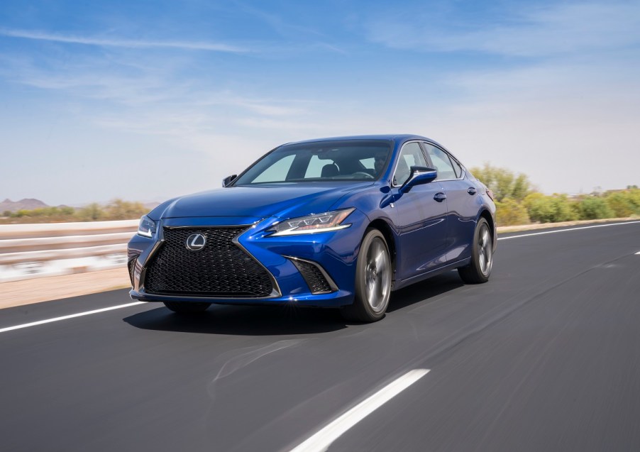 A blue 2020 Lexus ES shows off its luxury car styling on a desert road.