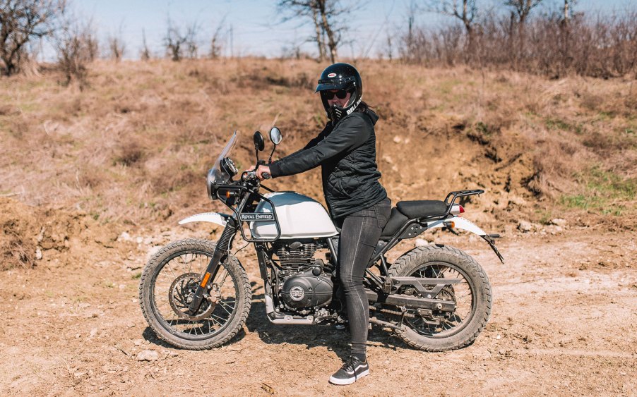 Rider sitting on 2020 Royal Enfield Himalayan on a muddy road