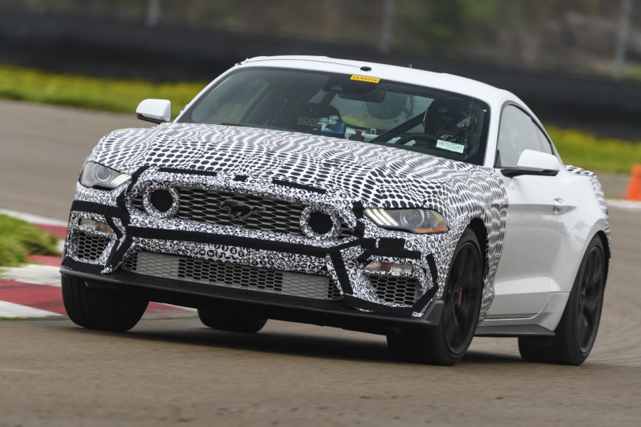 White-and-black camouflaged 2021 Ford Mustang Mach 1 testing on the racetrack