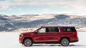 A red 2021 GMC Yukon XL Denali in the snow