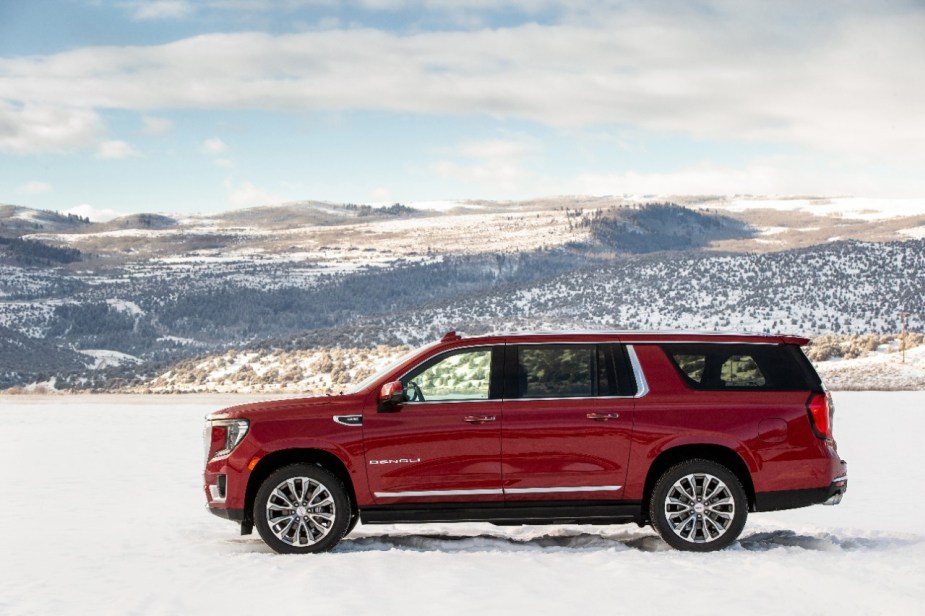 A red 2021 GMC Yukon XL Denali in the snow.