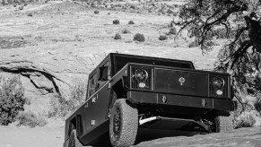 Bollinger B2 electric truck climbing up a rocky hill