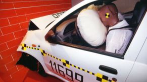 A crash test dummy and meets a deployed airbag