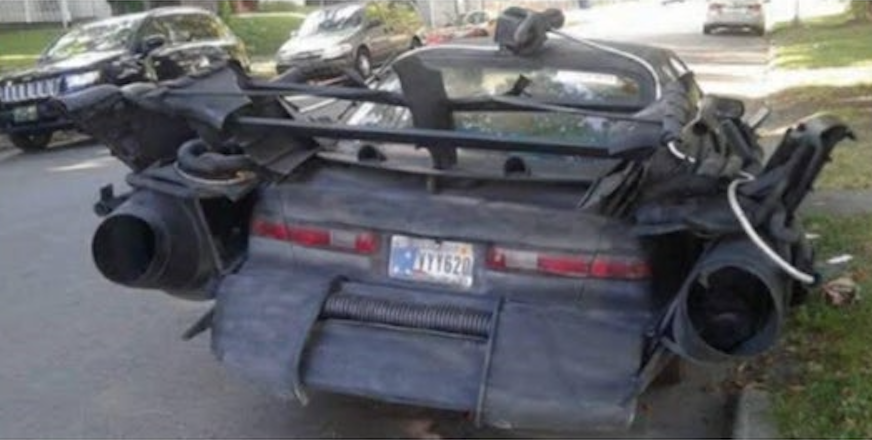 rear 3/4 view of an arbitrary apocalyptic sedan for Freak Show Friday