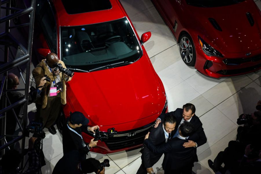 Honda executives celebrate as the 2018 Honda Accord is named the car of the year at the 2018 North American International Auto Show