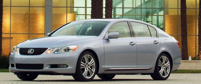 parked silver 2006 Lexus GS in front of a palm-lined mansion