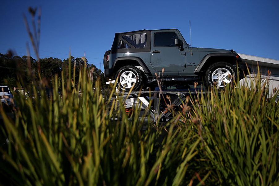 A Jeep Wrangler on display at a car dealership