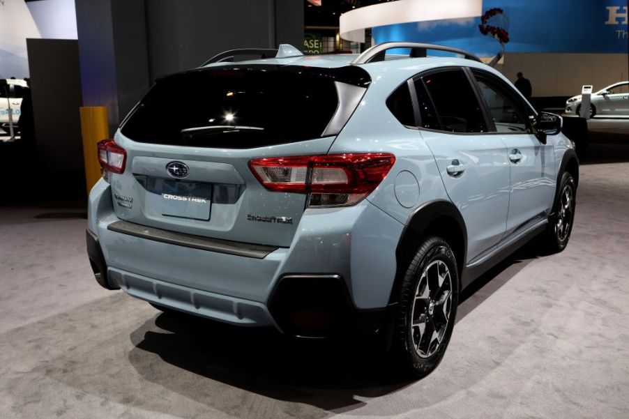 A Subaru Crosstrek seen from the back at an auto show