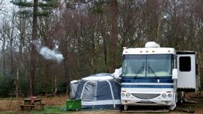 A campsite set up next to an RV